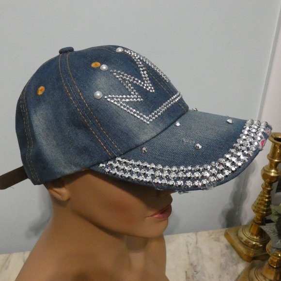 Frayed denim cap with crown tiara of sparkling silver metal faced riveted beads